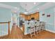 Stylish kitchen features bar seating, stainless appliances, and seamlessly connects to other living spaces at 670 2Nd Ave. N, North Myrtle Beach, SC 29582