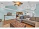 Spacious living area with sectional sofa, vaulted ceilings, and open layout leading to the kitchen and breakfast nook at 670 2Nd Ave. N, North Myrtle Beach, SC 29582