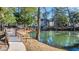 Scenic view of a pond with ducks and a walking bridge in a beautiful neighborhood at 670 2Nd Ave. N, North Myrtle Beach, SC 29582