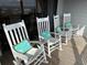 Covered balcony with rocking chairs and ocean view at 671 Norris Dr., Pawleys Island, SC 29585