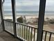 Screened in balcony with view of the beach at 671 Norris Dr., Pawleys Island, SC 29585