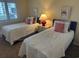 Bedroom featuring twin beds, a window view, carpeted floors, and beach decor at 671 Norris Dr., Pawleys Island, SC 29585