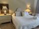 Bright bedroom featuring a white upholstered headboard, crisp linens and a bedside table at 671 Norris Dr., Pawleys Island, SC 29585