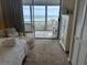 Bedroom with sliding glass doors leading to the beach-facing balcony at 671 Norris Dr., Pawleys Island, SC 29585