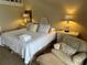 Bedroom featuring two nightstands, a relaxing chair and an ottoman at 671 Norris Dr., Pawleys Island, SC 29585
