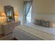 Bedroom featuring queen bed, dresser with mirror, carpeted floors, and natural light at 671 Norris Dr., Pawleys Island, SC 29585