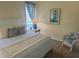 Bedroom featuring queen bed, white furniture, carpeted floors, natural light, and beach decor at 671 Norris Dr., Pawleys Island, SC 29585