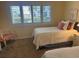 Bedroom featuring twin beds, a window view, and carpeted floors at 671 Norris Dr., Pawleys Island, SC 29585