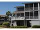 Charming exterior view of this three story beach home, featuring screened in porches and ocean views at 671 Norris Dr., Pawleys Island, SC 29585