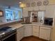 Bright kitchen area featuring stainless steel oven, sink, and dishwasher, and an open view to the other rooms at 671 Norris Dr., Pawleys Island, SC 29585