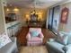 Bright living room with ocean views and open layout to the dining and kitchen areas at 671 Norris Dr., Pawleys Island, SC 29585