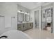 Spacious bathroom features dual vanity, soaking tub, and modern white countertops at 6892 Belancino Blvd., Myrtle Beach, SC 29572