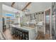 Elegant kitchen with a large island, stainless steel appliances, and stylish pendant lighting at 6892 Belancino Blvd., Myrtle Beach, SC 29572