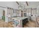 Well-appointed kitchen featuring a center island, modern appliances, and custom cabinetry at 6892 Belancino Blvd., Myrtle Beach, SC 29572