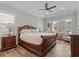 Comfortable main bedroom with trey ceiling, ceiling fan, and large windows at 6892 Belancino Blvd., Myrtle Beach, SC 29572