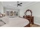 Comfortable main bedroom showcases trey ceilings, fan, and ample natural light at 6892 Belancino Blvd., Myrtle Beach, SC 29572