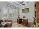 Charming office features an executive desk, comfortable chair, and bright windows with plantation shutters at 6892 Belancino Blvd., Myrtle Beach, SC 29572