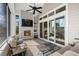 Inviting sunroom with fireplace and sliding glass doors at 6892 Belancino Blvd., Myrtle Beach, SC 29572