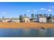 View of a backyard with a patio, screened in porch and lake access at 706 Gryffindor Dr., Little River, SC 29566