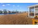 Enjoy stunning lake views from this home's backyard and patio area at 706 Gryffindor Dr., Little River, SC 29566