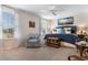 Bright and airy bedroom featuring large windows, comfortable seating, and stylish decor at 706 Gryffindor Dr., Little River, SC 29566