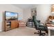 Well-equipped bedroom featuring a TV, comfortable seating, and a functional desk area at 706 Gryffindor Dr., Little River, SC 29566