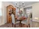 A charming dining room with a wooden table, upholstered chairs, and decorative hutch at 706 Gryffindor Dr., Little River, SC 29566