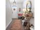 Stylish foyer boasts hardwood floors, a wooden console table, and ample natural light at 706 Gryffindor Dr., Little River, SC 29566