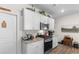 Bright kitchen with stainless steel appliances, granite countertops, and stylish upper cabinet decor at 706 Gryffindor Dr., Little River, SC 29566