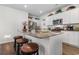 Modern kitchen island features granite countertops, stylish bar stools, and sleek stainless steel appliances at 706 Gryffindor Dr., Little River, SC 29566