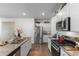 Modern kitchen with stainless steel appliances, granite countertops, and a convenient kitchen island at 706 Gryffindor Dr., Little River, SC 29566