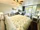 Comfortable bedroom and seating area features a bright beach themed aesthetic at 7200 N Ocean Blvd. # 136, Myrtle Beach, SC 29572