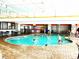 Enjoy year-round swimming in this well-lit indoor pool area, with ample seating and a vibrant atmosphere at 7200 N Ocean Blvd. # 136, Myrtle Beach, SC 29572