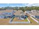 Aerial view of the backyard featuring a screen porch, patio, and a white picket fence at 738 Harrison Mill St., Myrtle Beach, SC 29579