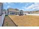 Large backyard with patio, outdoor seating, and a well-maintained white picket fence at 738 Harrison Mill St., Myrtle Beach, SC 29579