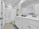 Bright bathroom with a combined shower/tub and white vanity with chrome fixtures at 738 Harrison Mill St., Myrtle Beach, SC 29579