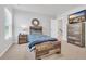 Bedroom with wooden bed set, TV, dresser, and plenty of natural light at 738 Harrison Mill St., Myrtle Beach, SC 29579
