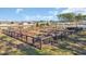 Community garden with plots, surrounded by a fence, offers residents fresh produce at 738 Harrison Mill St., Myrtle Beach, SC 29579