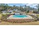 Aerial view of community pool, pool house and surrounding landscaping in a neighborhood at 738 Harrison Mill St., Myrtle Beach, SC 29579