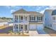 Charming home exterior with double balconies, two-car garage, and well-maintained landscaping at 738 Harrison Mill St., Myrtle Beach, SC 29579