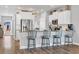 Modern kitchen featuring stainless steel appliances, granite countertops, and stylish breakfast bar seating at 738 Harrison Mill St., Myrtle Beach, SC 29579