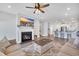 Open-concept living area with a fireplace, large TV, and eat-in kitchen at 738 Harrison Mill St., Myrtle Beach, SC 29579