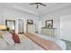 Bright bedroom with a dresser, mirrors, and neutral colored bedding at 738 Harrison Mill St., Myrtle Beach, SC 29579