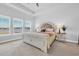 Calm bedroom with a decorative headboard, neutral decor, and lots of natural light at 738 Harrison Mill St., Myrtle Beach, SC 29579