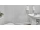 Simple half bathroom with pedestal sink and tile floors at 738 Harrison Mill St., Myrtle Beach, SC 29579