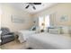Cozy bedroom with two twin beds, coastal-themed decor, and plenty of natural light at 768 Satterwhite Way, Myrtle Beach, SC 29577