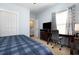Bright bedroom featuring a workspace, TV, and closet at 768 Satterwhite Way, Myrtle Beach, SC 29577