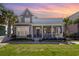 Charming home with front porch, second story balcony, manicured lawn, and beautiful landscaping at 768 Satterwhite Way, Myrtle Beach, SC 29577