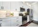 Stylish kitchen boasting white cabinets, stainless appliances, and ample counter space at 768 Satterwhite Way, Myrtle Beach, SC 29577