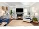 Cozy living room with fireplace, large TV, area rug, and decorative accents at 768 Satterwhite Way, Myrtle Beach, SC 29577